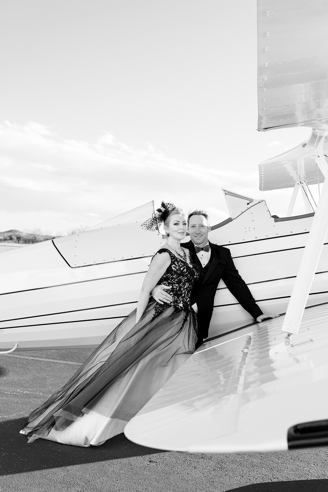 Wedding couple in front of plane during their elopement, shot by Rachel J Hahn Photography